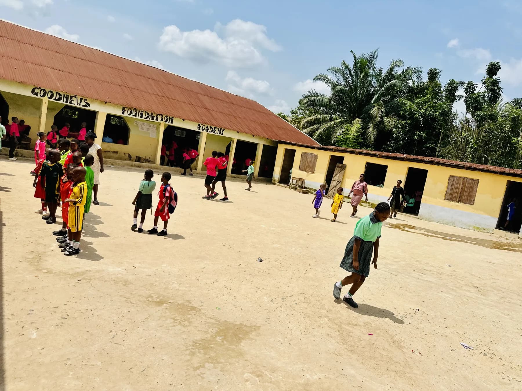Young pupils learning and playing within the Goodnews school community