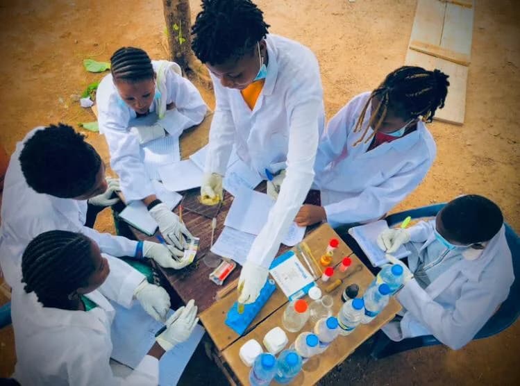 Goodnews students carrying out a science practical